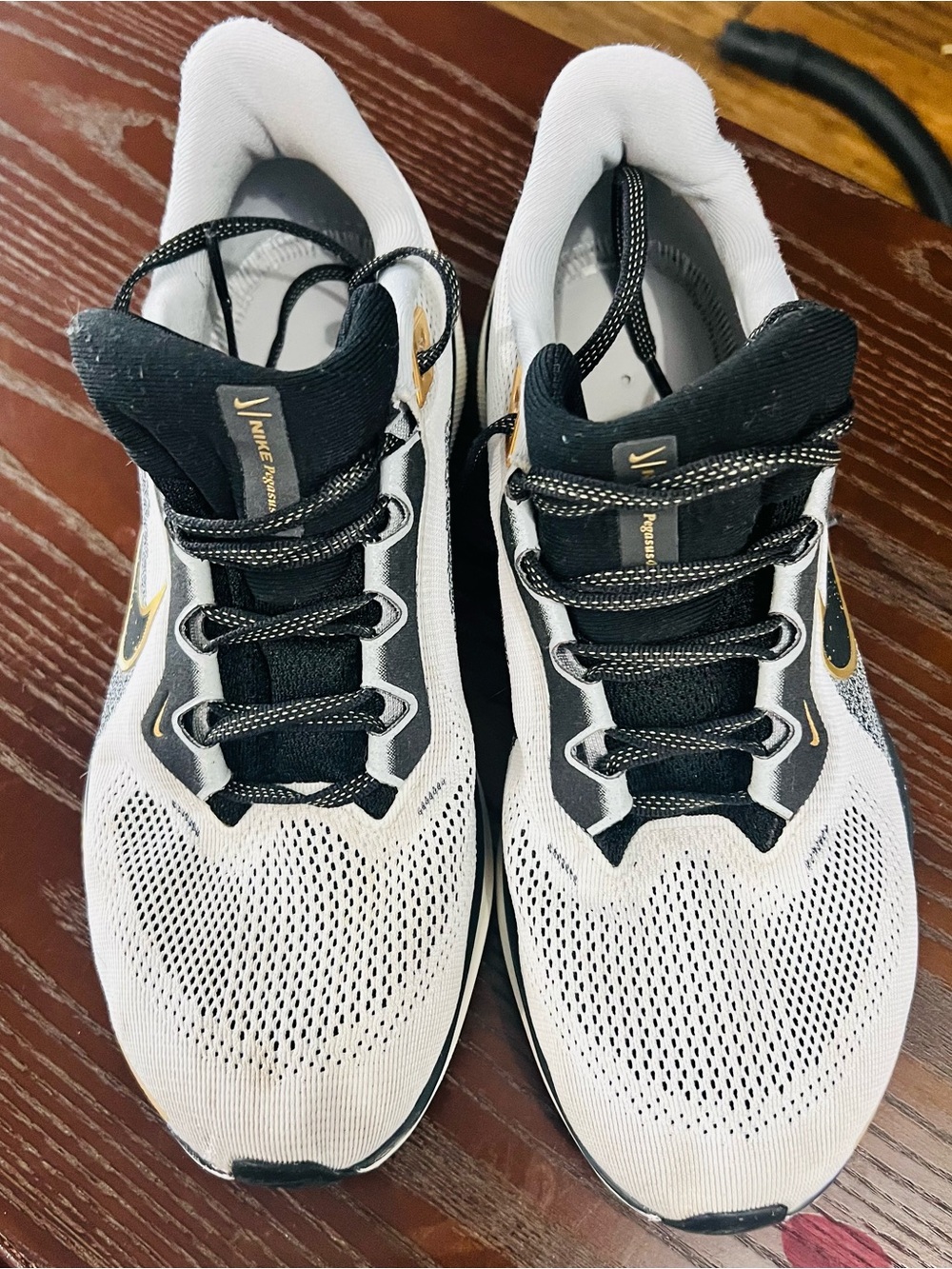 Nike Pegasus 41 Premium in the white/black/metallic-gold colourway